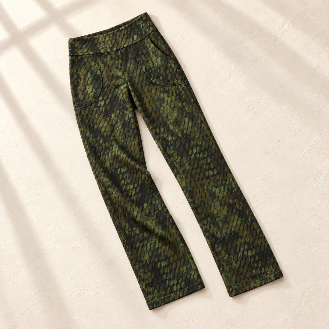 Green mosaic knit pants laid on an ivory background