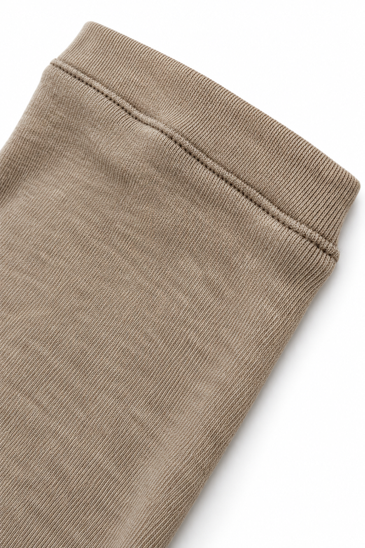 Beige merino wool crew neck, cuff view on white background