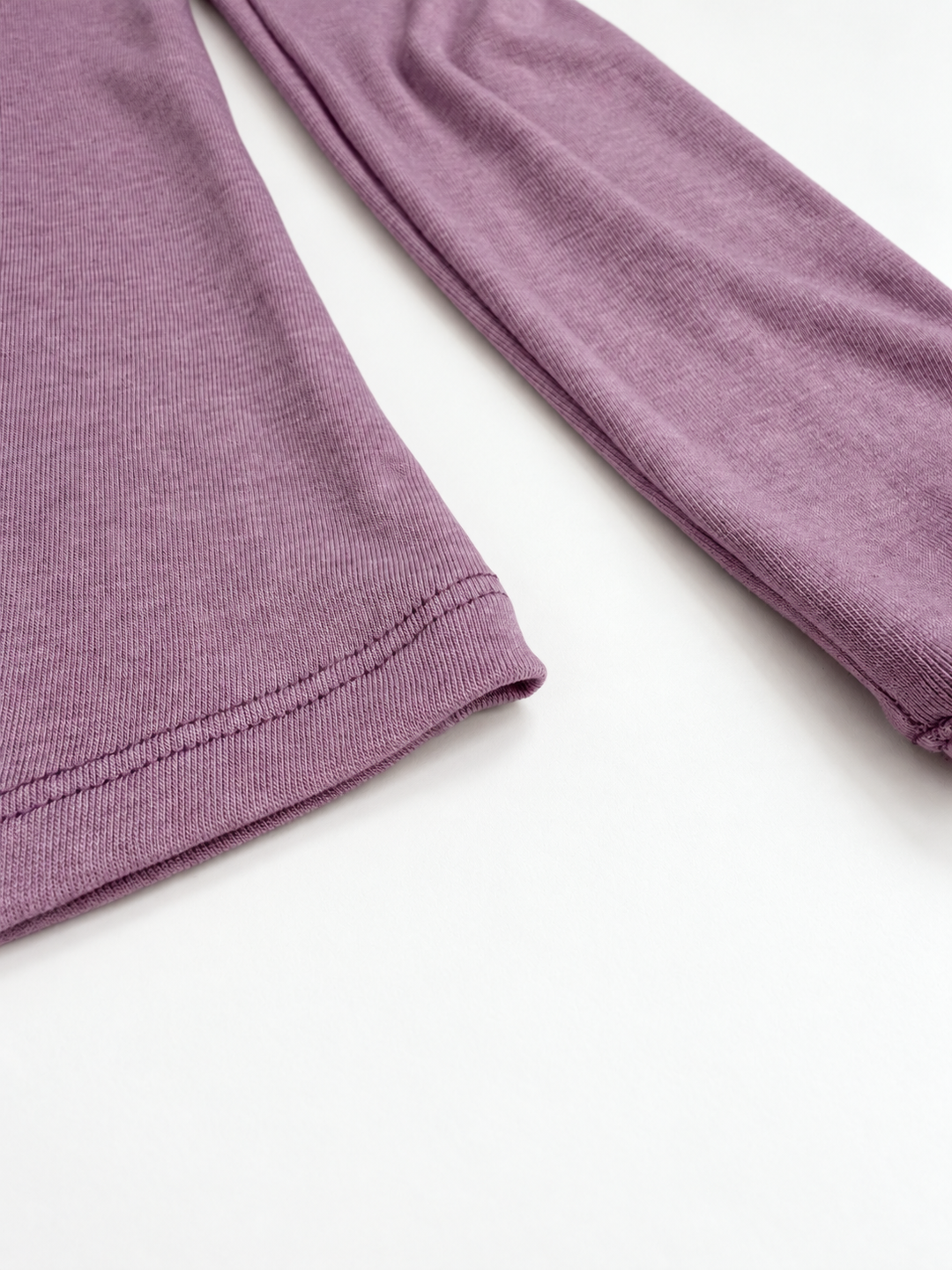 Lavender merino crew neck hem and sleeve close-up, knit direction matched to original photograph