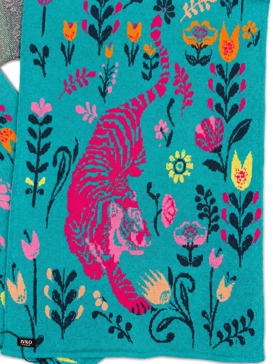 Close-up of the IVKO Feral Grace Adria wool scarf showing the pink tiger, floral motifs and knitted wool texture.