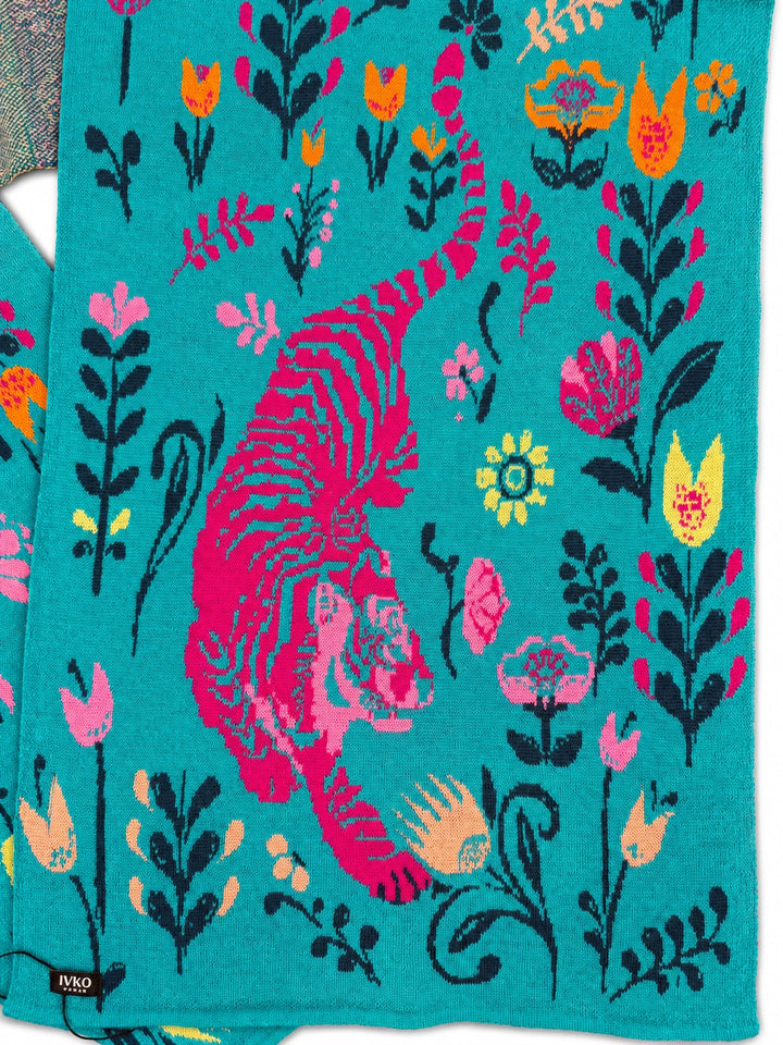 Close-up of the IVKO Feral Grace Adria wool scarf showing the pink tiger, floral motifs and knitted wool texture.