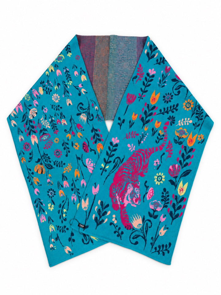 IVKO Feral Grace wool scarf in Adria turquoise, laid flat to show its pink tiger and colourful floral jacquard pattern.