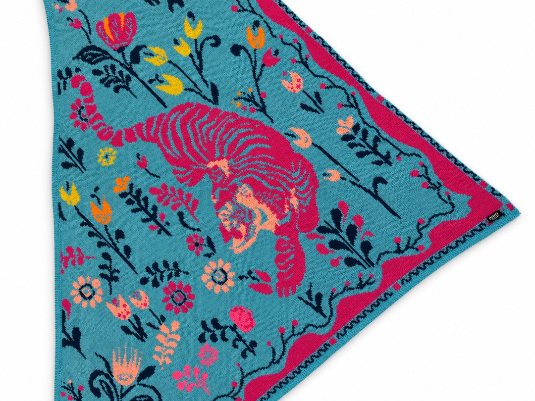 Detail of the IVKO Wild Garden Adria triangle scarf showing the tiger, floral jacquard and decorative border.