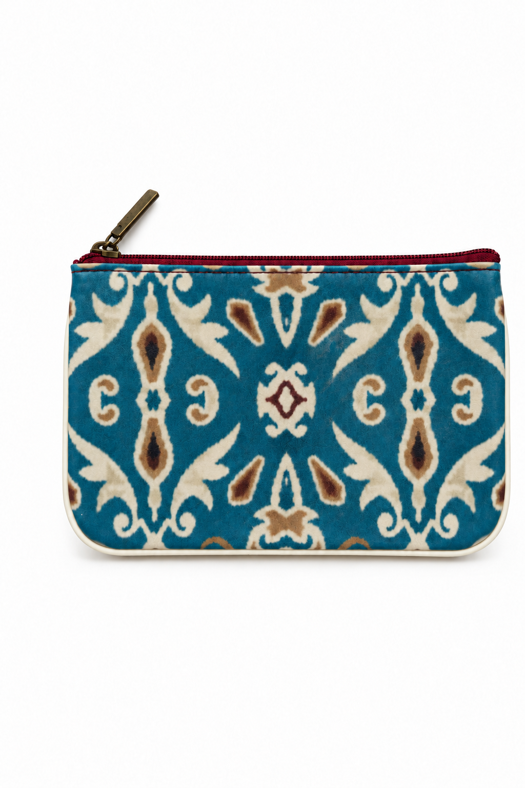 Blue zip pouch with cream and brown ornamental pattern and burgundy zipper on a white background